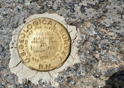 Survey marker at the top of Argentine Pass